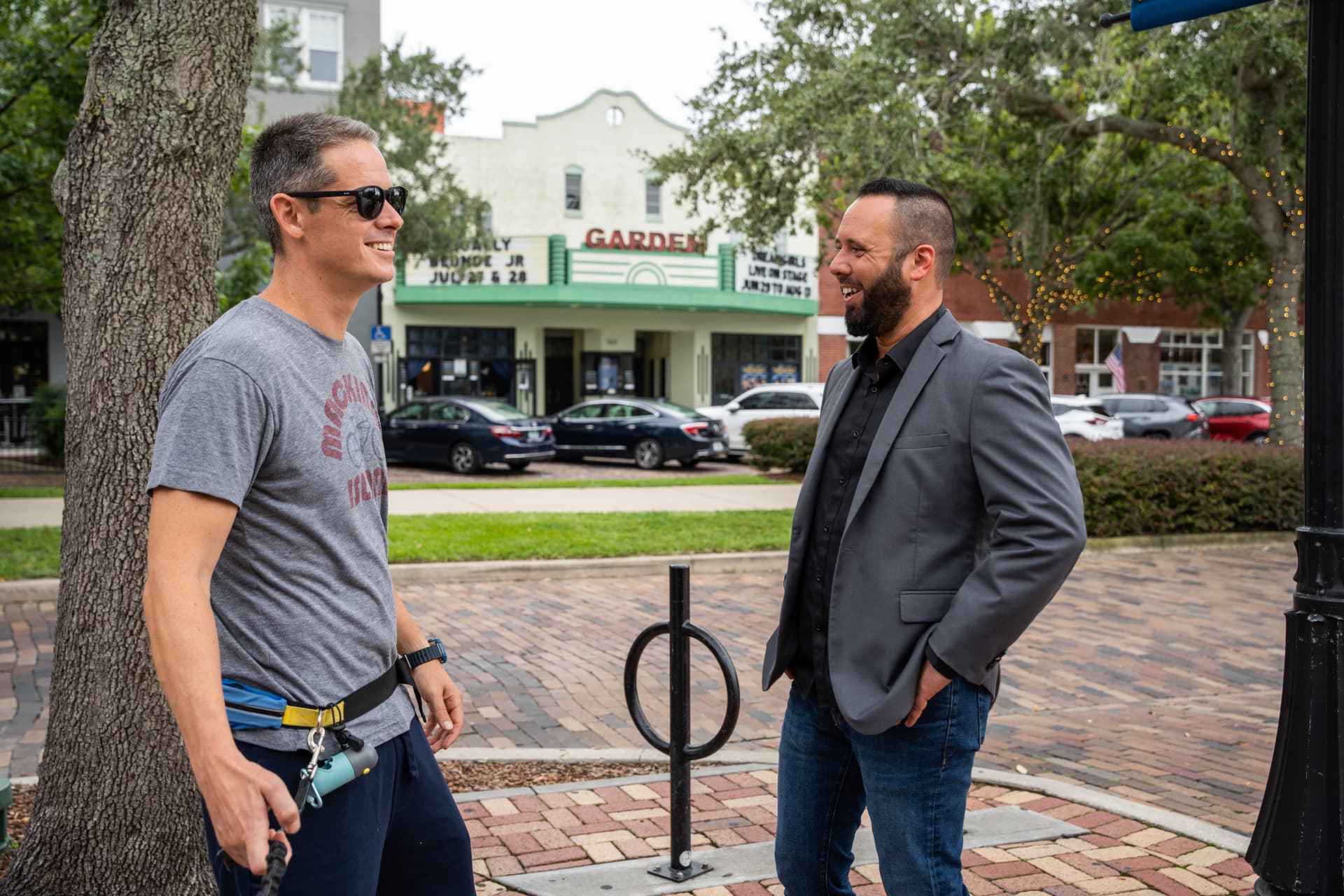 Austin Arthur talking with a resident outside the Garden Theatre in historic downtown Winter Garden, Florida